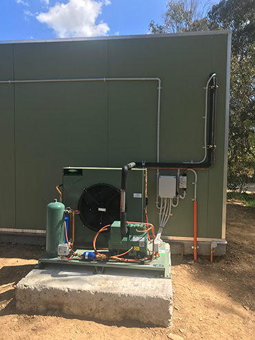 Commercial Refrigeration Unit Outside Freezer Room